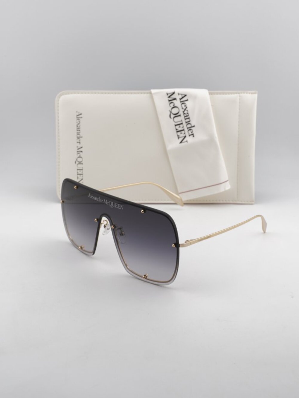 Alexander McQueen AM0362S 003 Shield Rimless Sunglasses - Gold / Grey